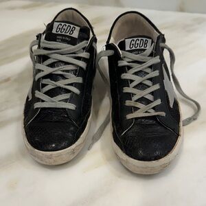 Golden Goose Superstar Sneakers in Black and Cream